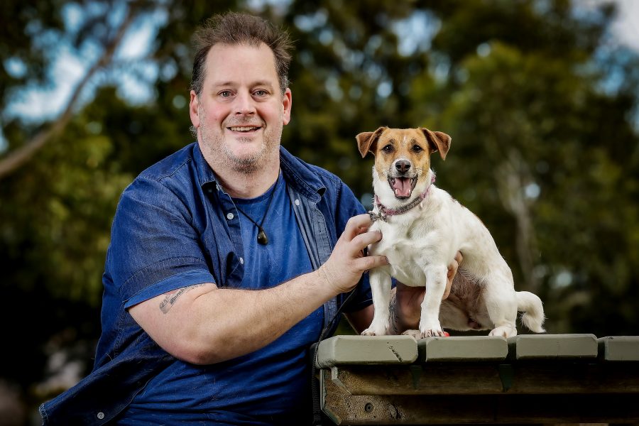 Vaughn Marshall poses with his Jack Russell dog 'Luna.'