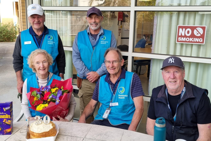 Rosebud Hospital garden volunteers with a cake celebrating 30 years